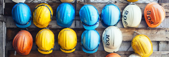 Contractor hats hung up on wall